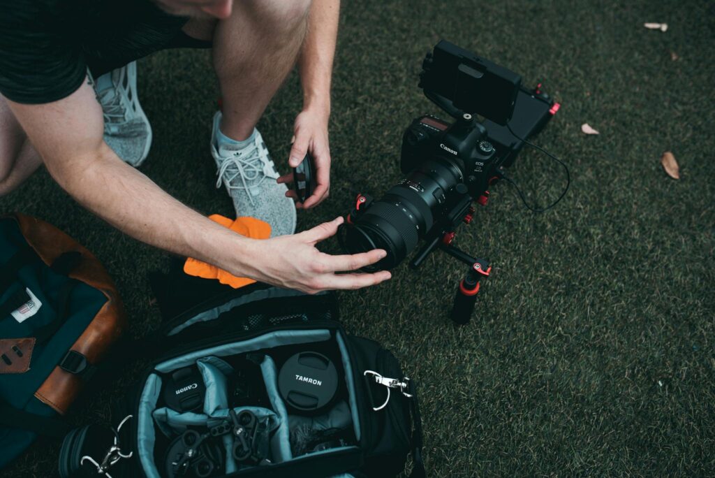 Man Holding Camera Lens